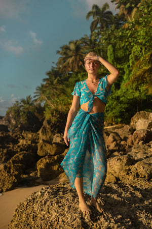 Luxury beach vacation style chiffon silk sarong worn with lyla top in Lurcher green & blue print by designer Lotty B Mustique