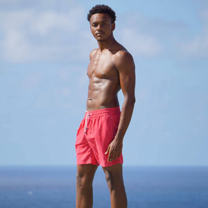 Mens quick-dry swim trunks in faded red designer Lotty B Mustique for Pink House vacation essentials