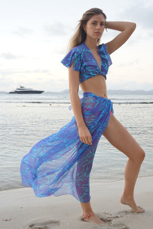 Luxury silk chiffon beach pareo in purple & blue Protea print by designer Lotty B Mustique