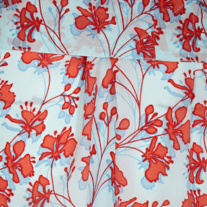 Bed to beach robe Flamboyant Flower orange aqua blue back pleat detail designer Lotty B Mustique
