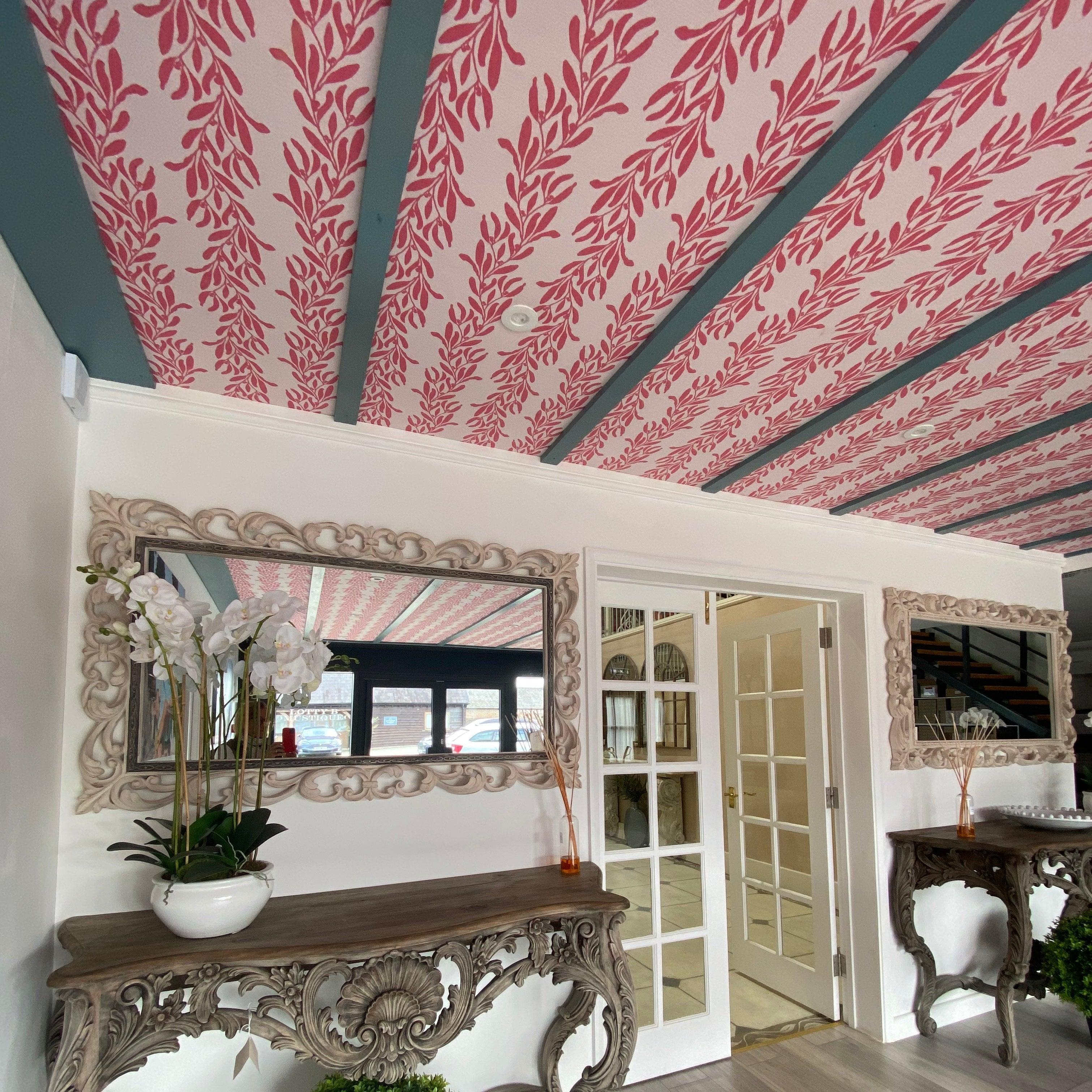 Semley showroom interior with ornate mirrors, pink leaf-pattern ceiling, decorative tables