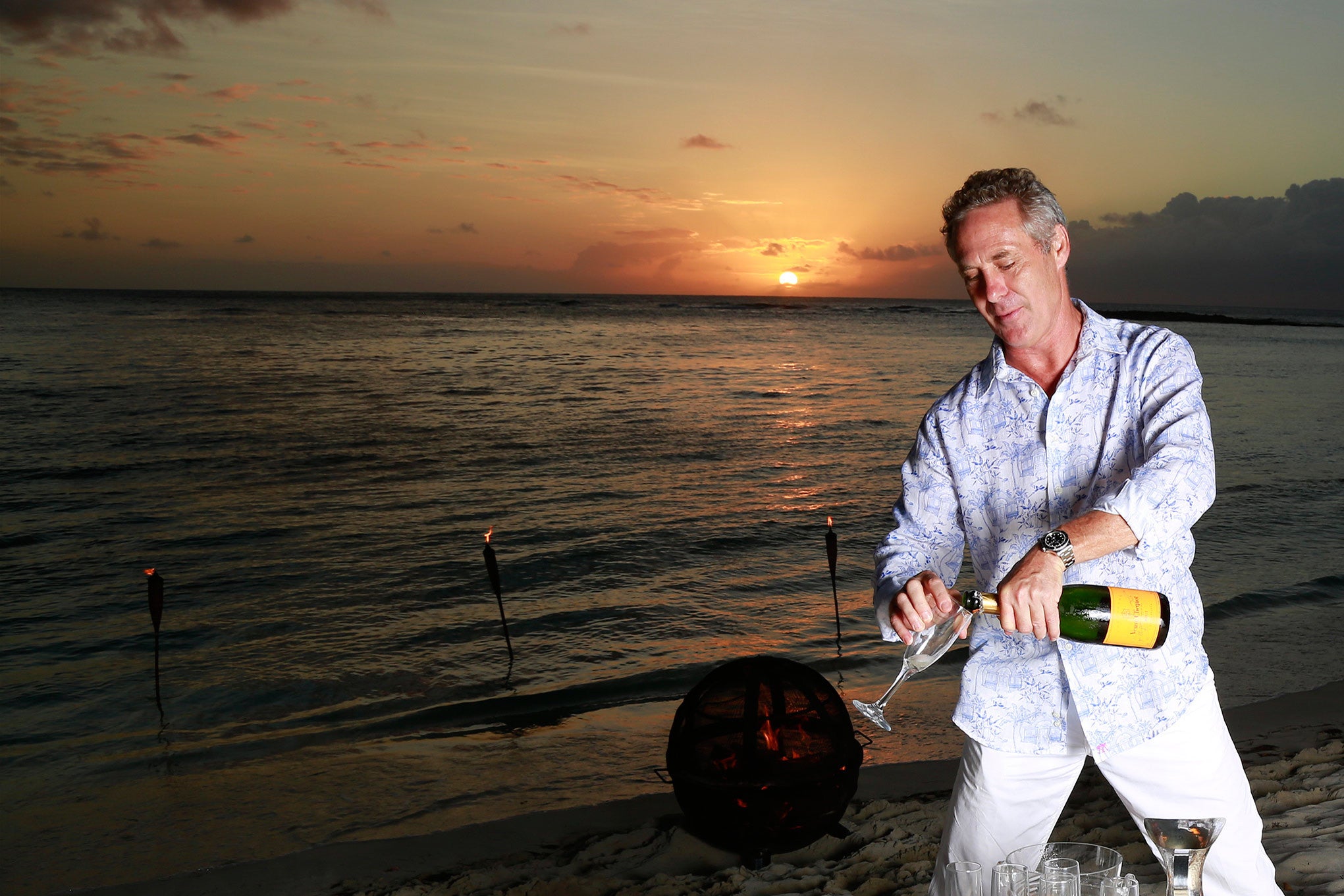 sunset champagne at lagoon Bay Mustique