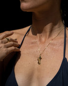 Mustique Island pendant in solid 18k gold on fine chain, luxury Caribbean island jewellery close-up