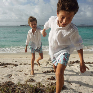 Classic pure white linen kids shirt perfect for a beach holiday