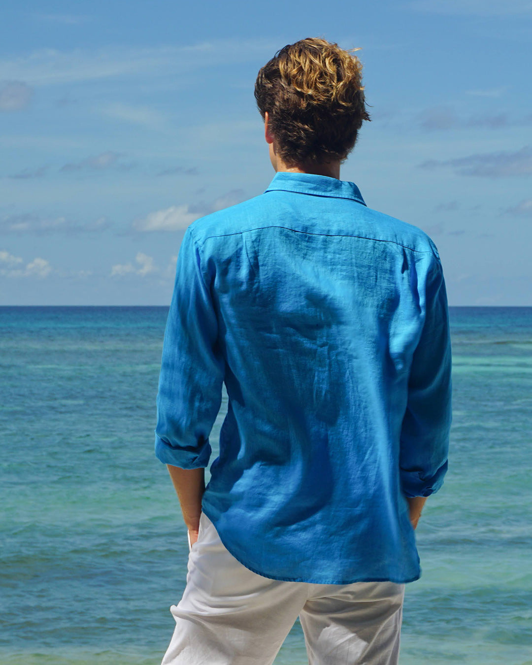 Caribbean vacation style in a mens bright turquoise linen shirt by Pink House Mustique