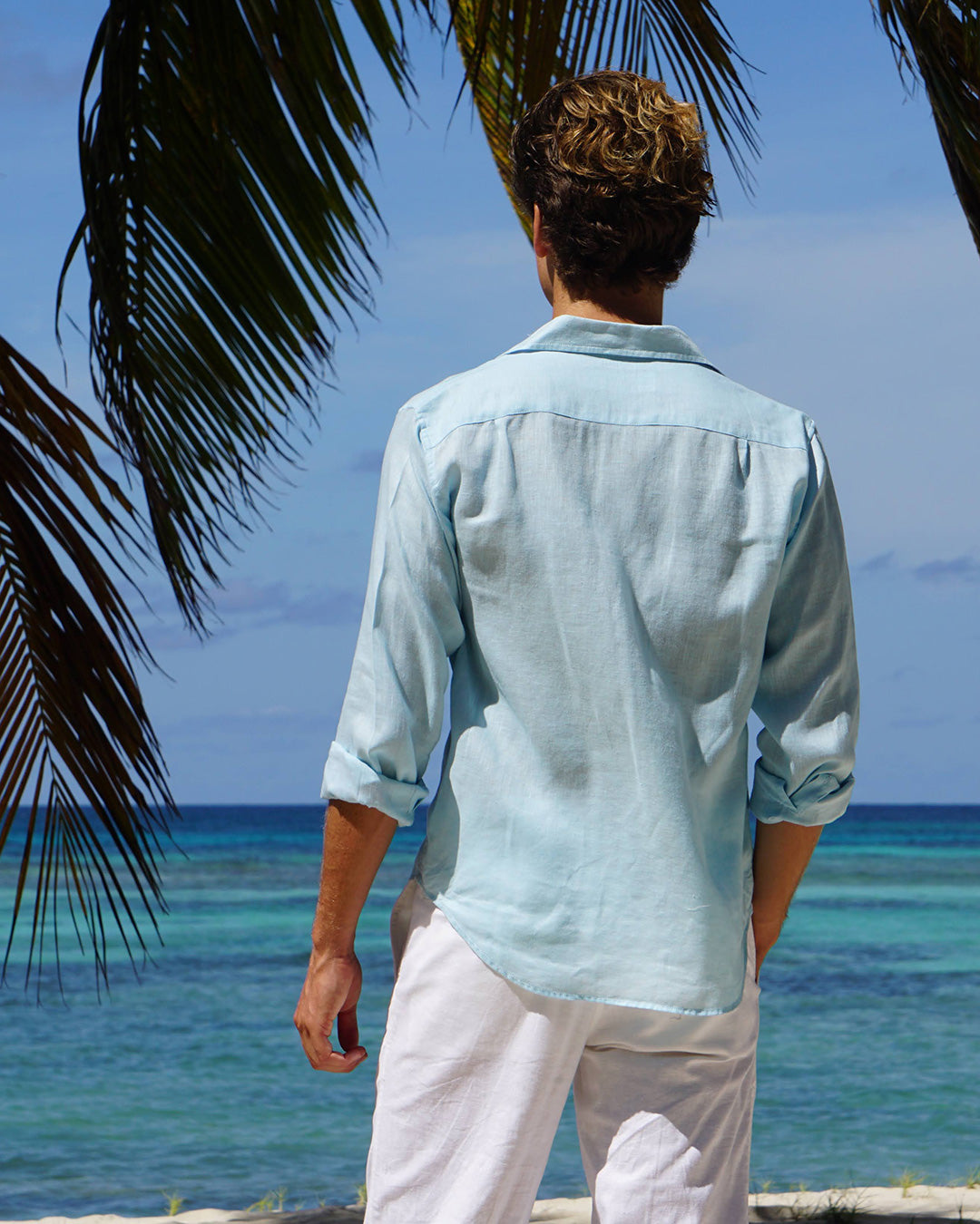 Mens vacation style in designer linen shirt in pale blue by Lotty B, Mustique 