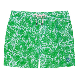 Mens swim shorts in green and blue floral protea print by designer Lotty B for Pink House Mustique