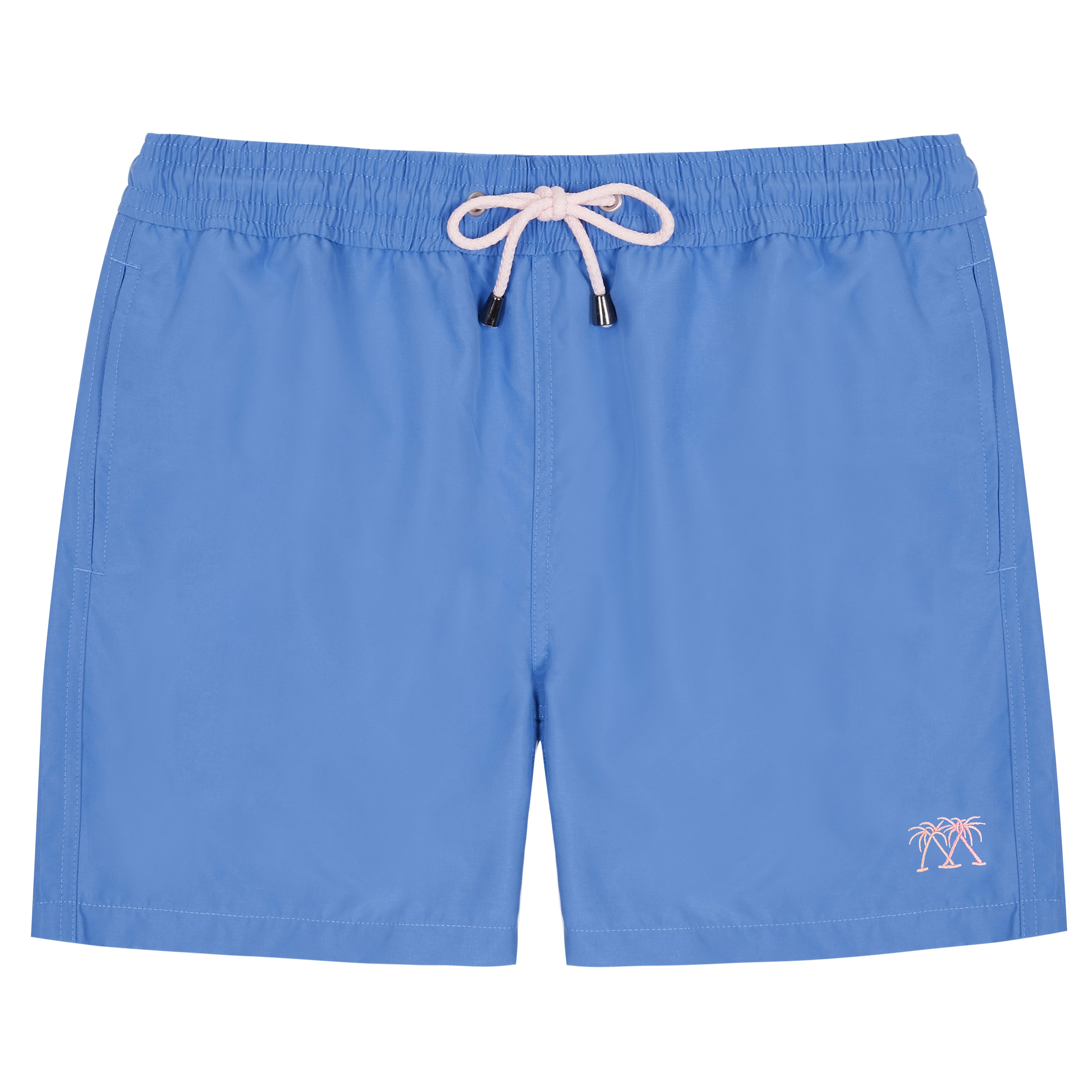 Close-up of blue swim trunks shorts with a pocket and button on a white background