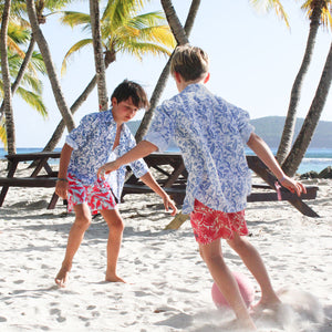 Kids unisex linen beach vacation shirt in tropical blue parrot print by designer Lotty B