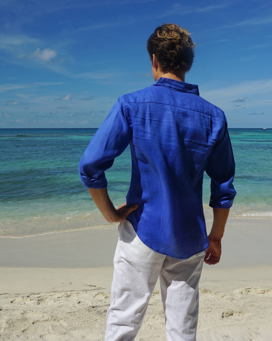 Folded Mens designer Linen Shirt by Lotty B for Pink House Mustique in plain Dazzling Blue