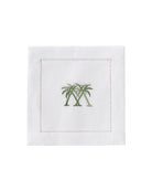 White linen cocktail napkin with green embroidered crossed palms – luxury tropical napkin