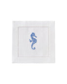 White linen cocktail napkin with blue embroidered seahorse – tropical linen tableware