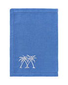 Luxury blue linen placemat with white palm tree embroidery – Pink House Mustique pure linen tropical table setting