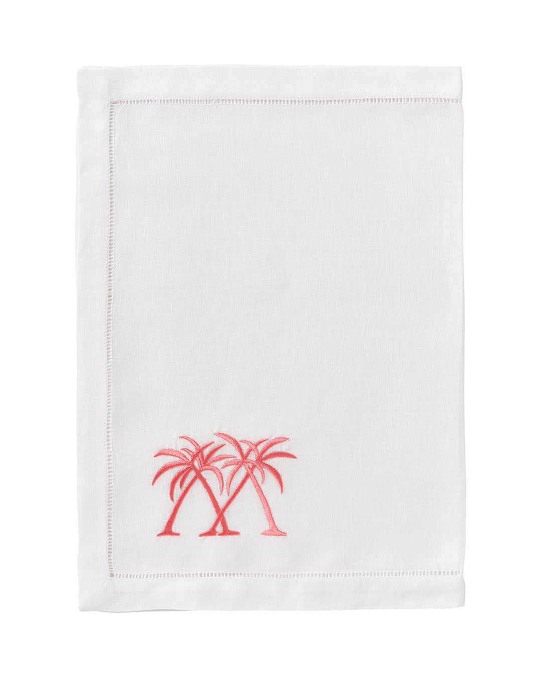 White linen placemat with coral pink palm tree embroidery – designer beach house table linen by Pink House Mustique