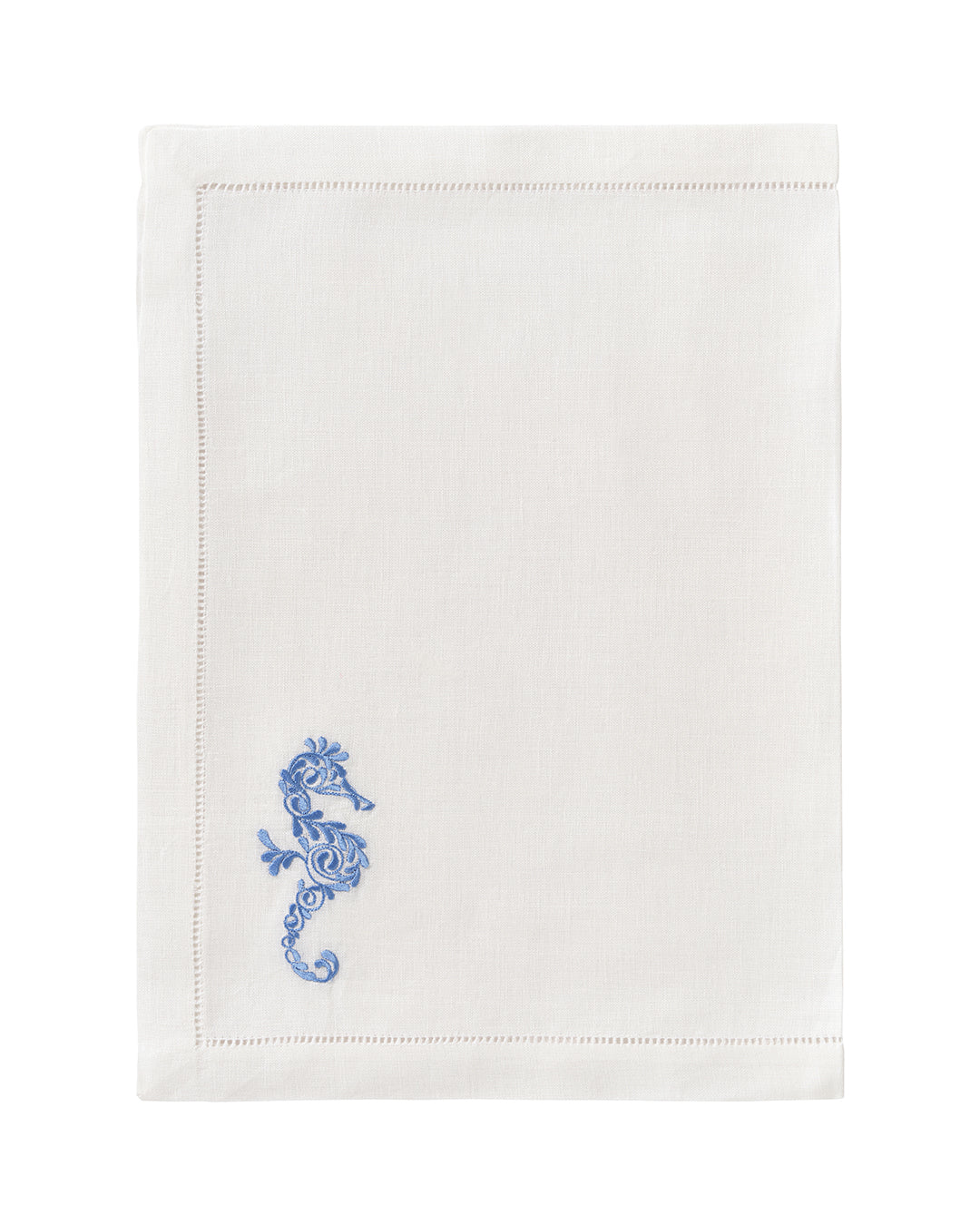 White linen placemat with azure blue embroidered seahorse – nautical coastal decor table linen by Pink House Mustique