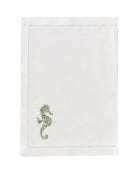 White linen placemat with sage green embroidered seahorse – luxury coastal embroidered table linen by Pink House Mustique