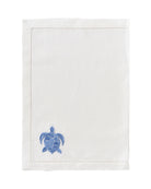 White linen placemat with azure blue embroidered turtle – nautical turtle motif table linen by Pink House Mustique