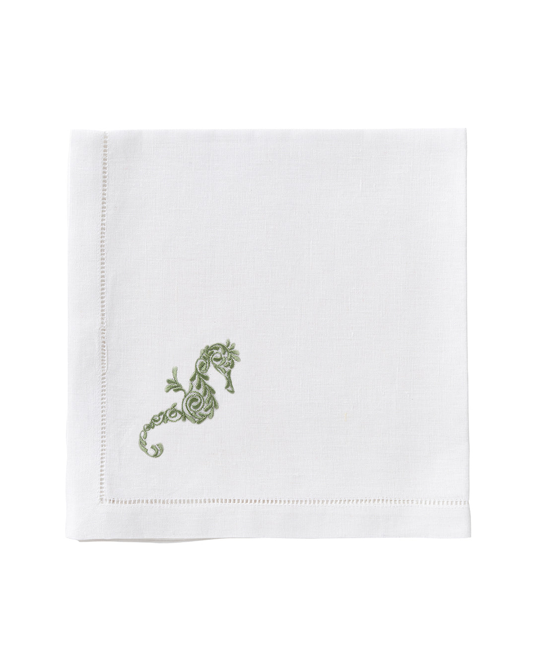 White linen napkin with green embroidered seahorse – artisan table linen for summer entertaining and coastal living