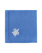 Pure linen napkin in azure blue with white turtle embroidery – marine-inspired luxury coastal table linen
