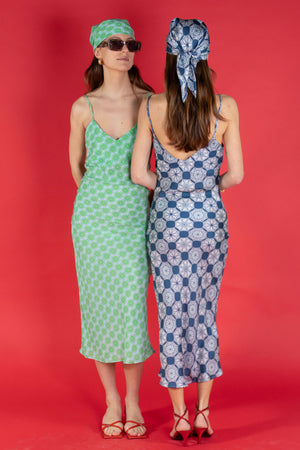 two women with matching silk bandanas and dress