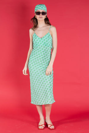 Kate silk summer dress in lime slice green worn with matching bandana designer Lotty B Mustique for Pink House Atelier Collections