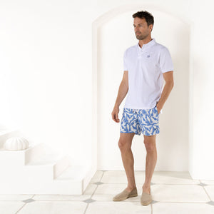 Men's beach swim shorts in blue Parrot print by designer Lotty B