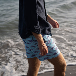 Sustainable Mens beach shorts in blue Egret bird print Cotton House pier, Mustique