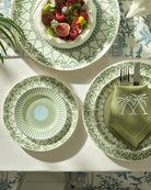 Chic fine bone china charger and side plates layered on salad plate in Palms Sage Green, luxury island tableware design.