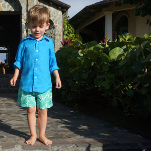 Kids sustainable swimwear in green floral Protea print
