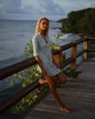 Decima silk dress in turquoise Whale print overlooking the Caribbean on Mustique