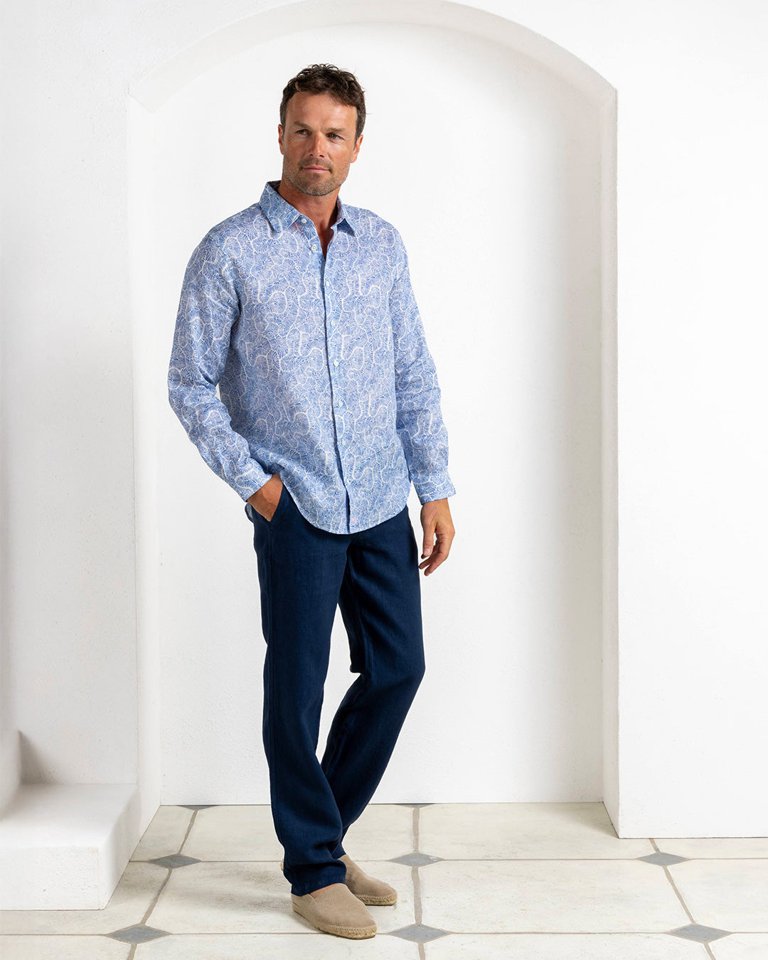 Designer men’s Coral Stone Blue linen shirt styled with Eclipse navy trousers, Pink House Mustique.