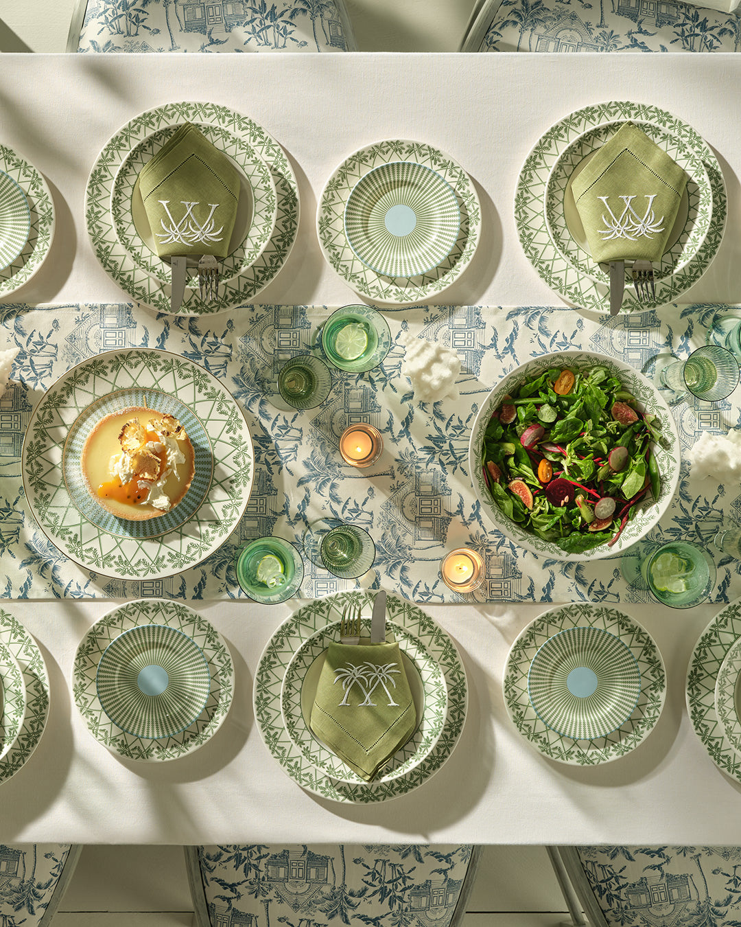 Designer fine bone china dinner set featuring round serving bowl in Palms Sage Green pattern, inspired by island living.
