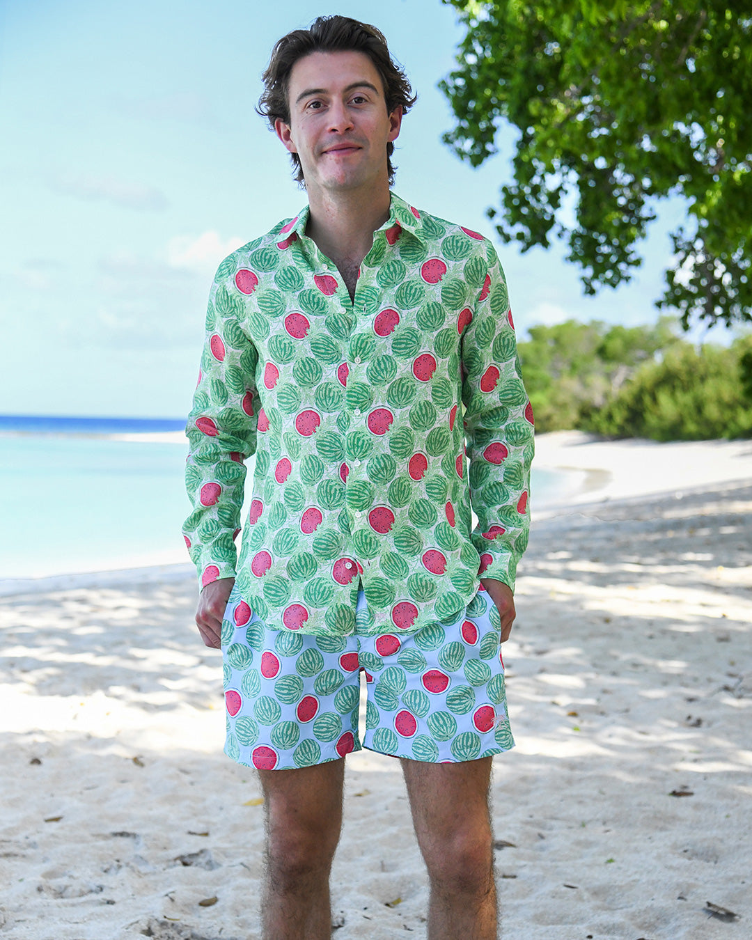 Man wearing Watermelon Green linen shirt with matching swim shorts on a Caribbean beach