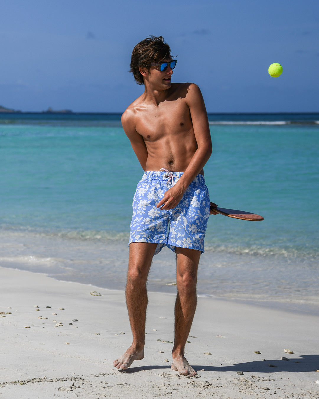 Designer Iguana Blue mid-length swim trunks by Pink House Mustique, regular European cut and Velcro® back pocket.