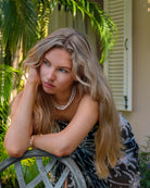 Style a pure chiffon silk sarong in black and white Plantation pattern as a skirt and worn with matching silk bandeau top by designer Lotty B Mustique Island