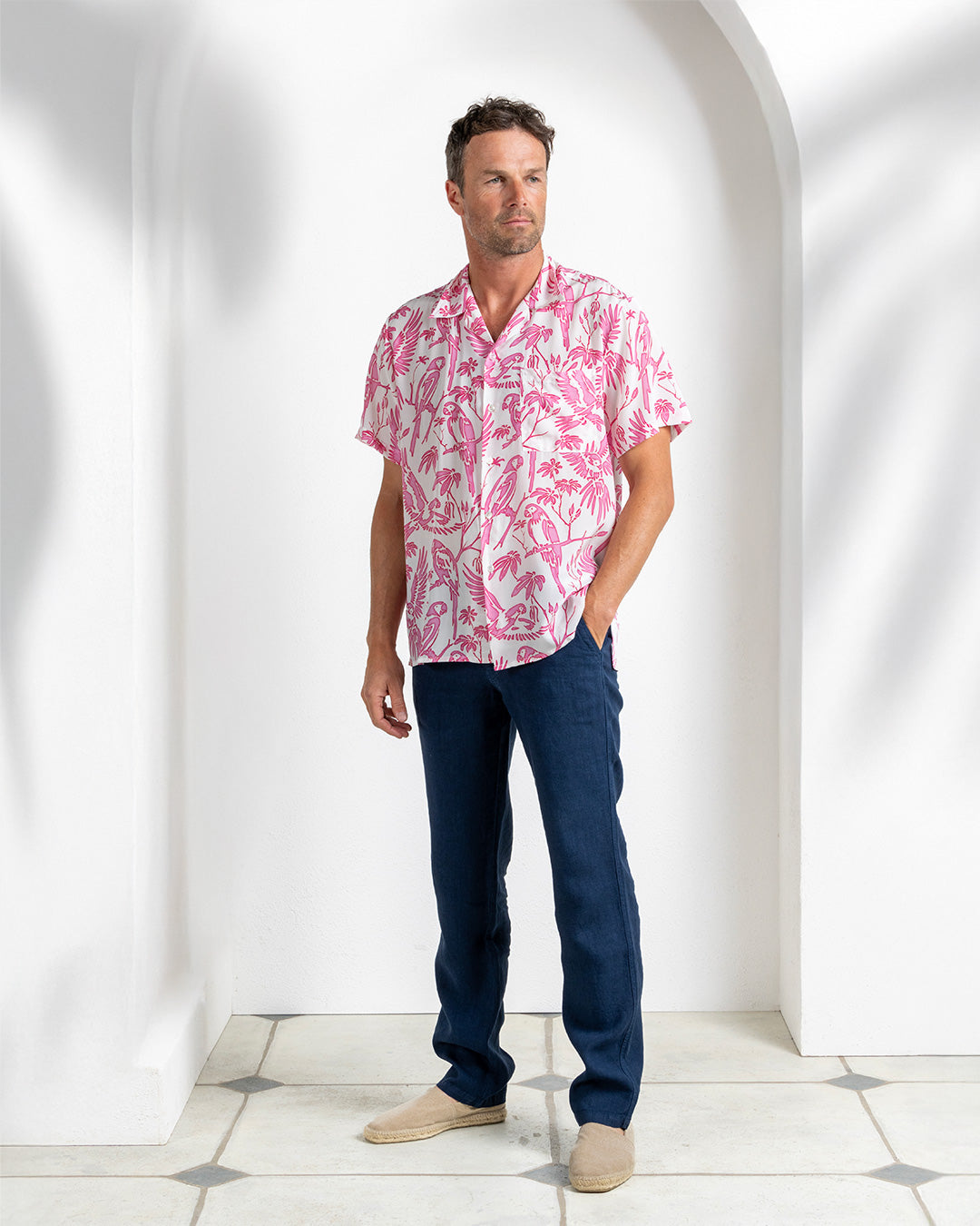 Stylish silk pink parrot print shirt with navy trousers – Pink House Mustique tropical men's clothing