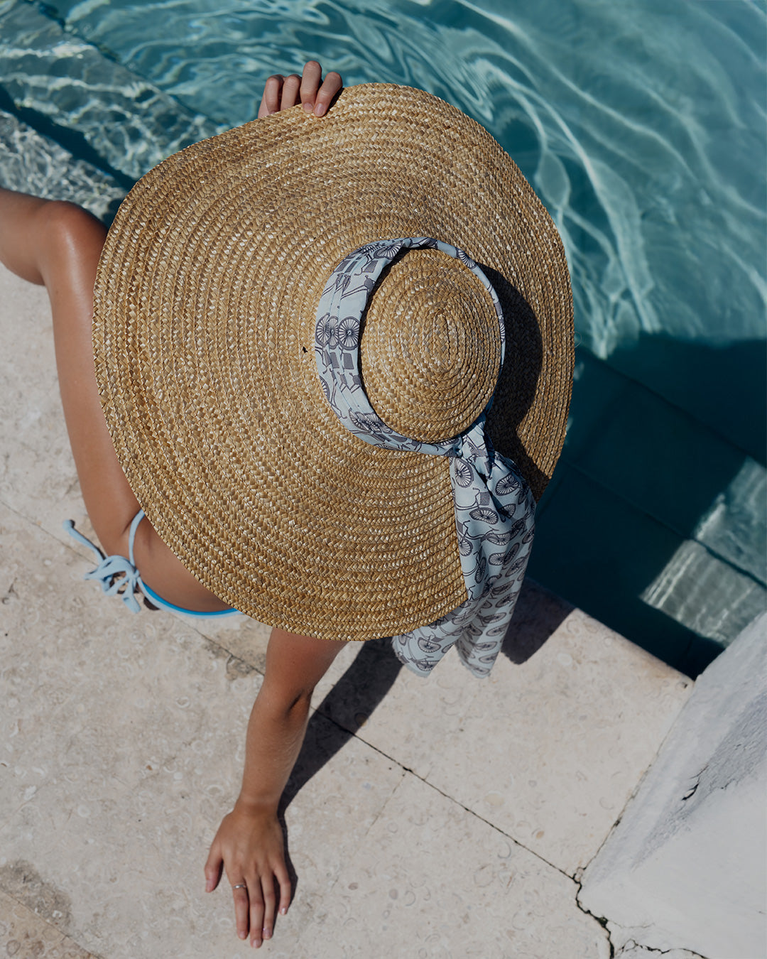 Designer long silk scarf bicycle black pale blue styled on a beautiful huge sun hat at Lavender Hill Villa, Mustique Island