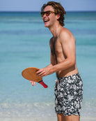 Designer Iguana Spruce swim shorts with recycled shell fabric, elastic waistband and secure Velcro® back pocket.