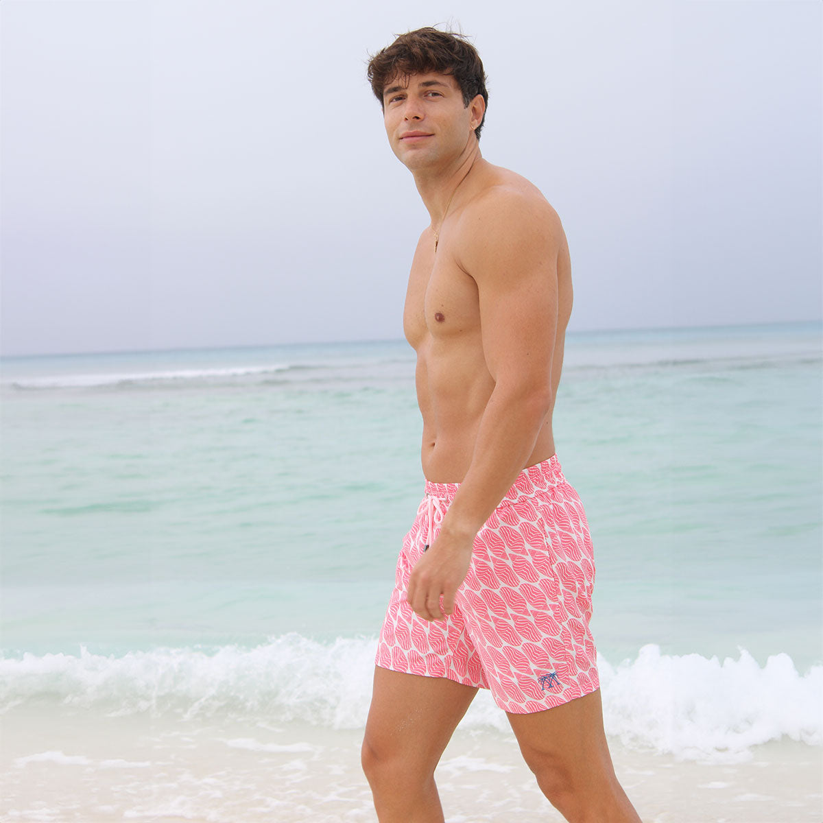 Men's beach holiday swim shorts in coral pink Striped Shell print by designer Lotty B