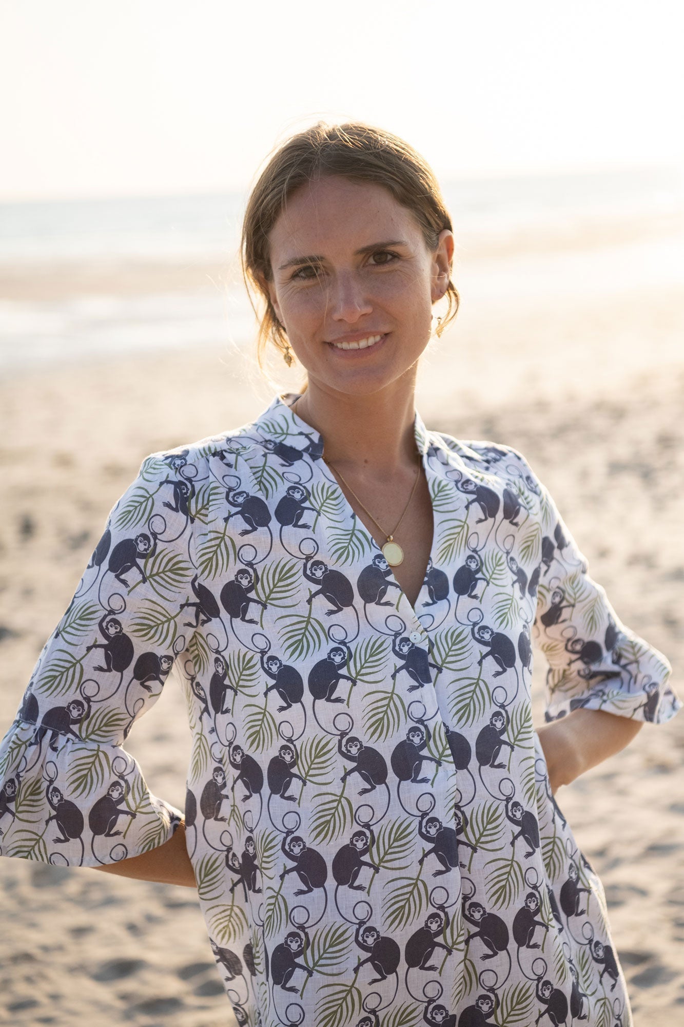 Resort style women's linen dress with frilled cuffs in green and navy Monkey print, the Decima dress by Pink House