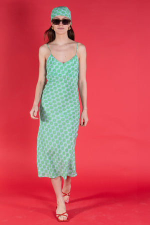 Lime Slice green patterned silk dress in lime slice green crepe de Chine designer Lotty B Mustique for Pink House Atelier Collections