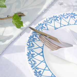 Set the table with fine bone china dinner plates in Palms blue design by Lotty B Mustique