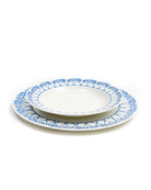 Showing the relative size of the dinner plate under the rimmed bowl in Palms Azure Blue design by Pink House Mustique.