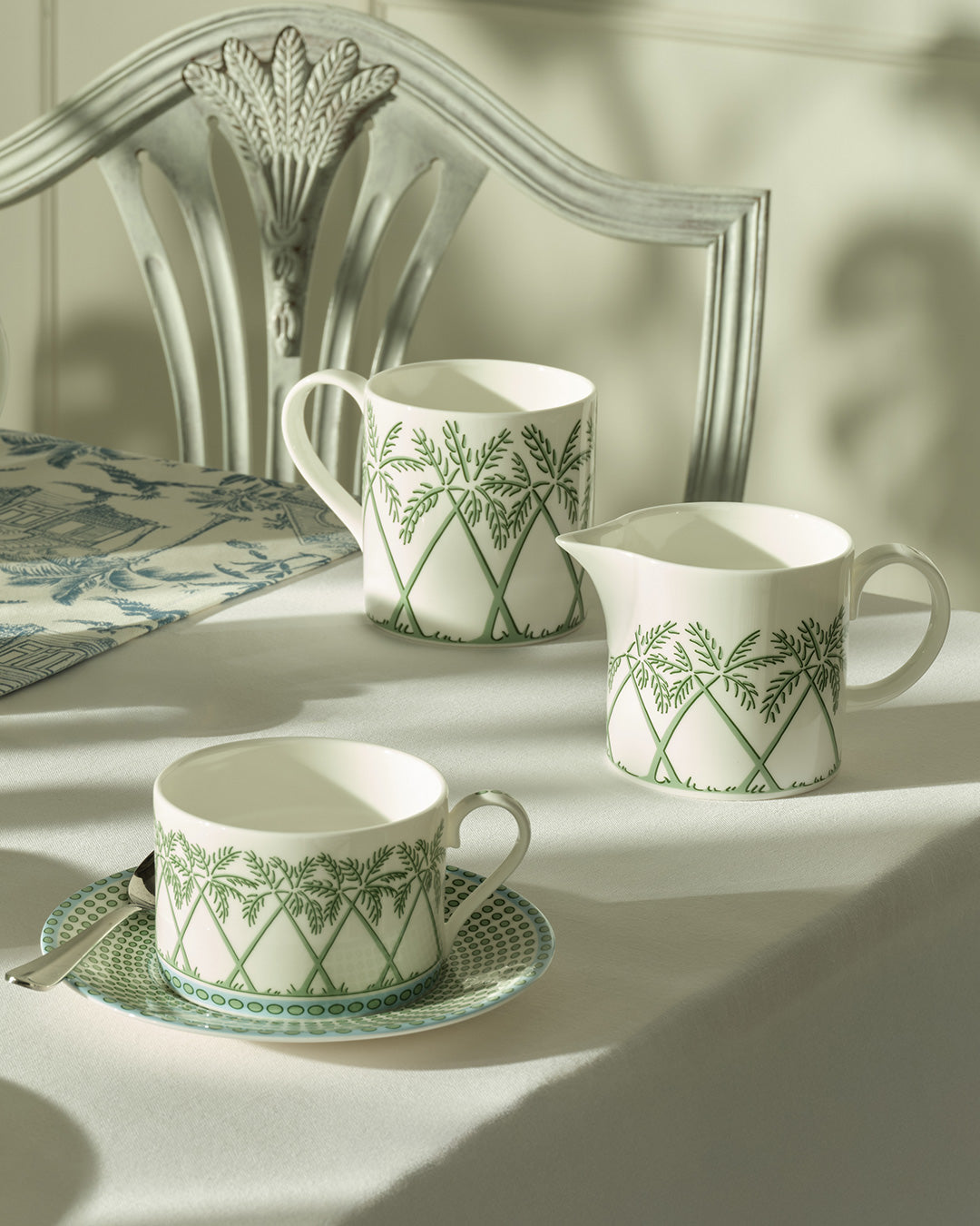 Fine bone china mug, milk jug and cup & saucer in Palms Sage Green by Lotty B Mustique, elegant English tea set.