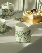 Fine bone china mug with cake plate and covered sugar pot in Palms Sage Green by Lotty B Mustique, luxury tableware.