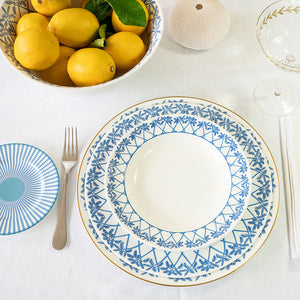 Place setting with fine bone china decorative charger plate, dinner plate and bowl in Palms blue design by Lotty B