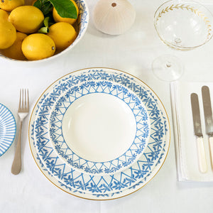 Place setting with fine bone china decorative charger plate, dinner plate and bowl in Palms blue design by Lotty B