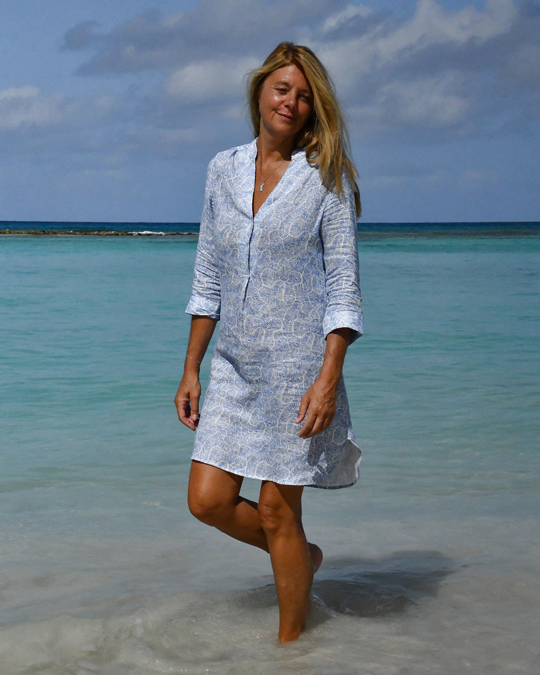 Katie wearing Coral Stone Blue linen Decima dress by Pink House Mustique, luxury resortwear.