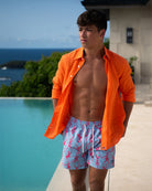 Pink House men’s orange linen shirt paired with drawstring swim shorts, relaxed Caribbean vacation styling