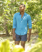 Caribbean holiday style in a mens bright turquoise linen shirt by Pink House Mustique